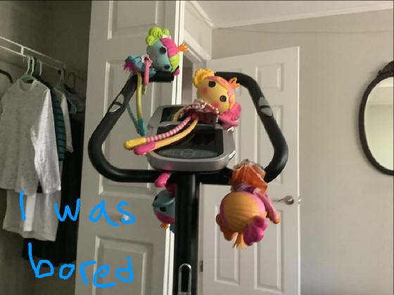 Dolls on an exercise bike